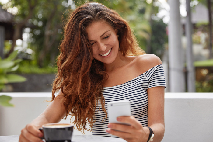 happy woman sitting coffee shop